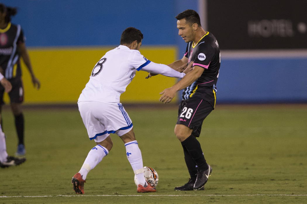 Montreal Impact’s Saphir Taider (8) pushes Las Vegas Lights FC Marcelo Julian Portugal (26) during the exhibition match at Cashman Field in Las Vegas, Saturday, Feb. 10, 2018. Montreal won  ...