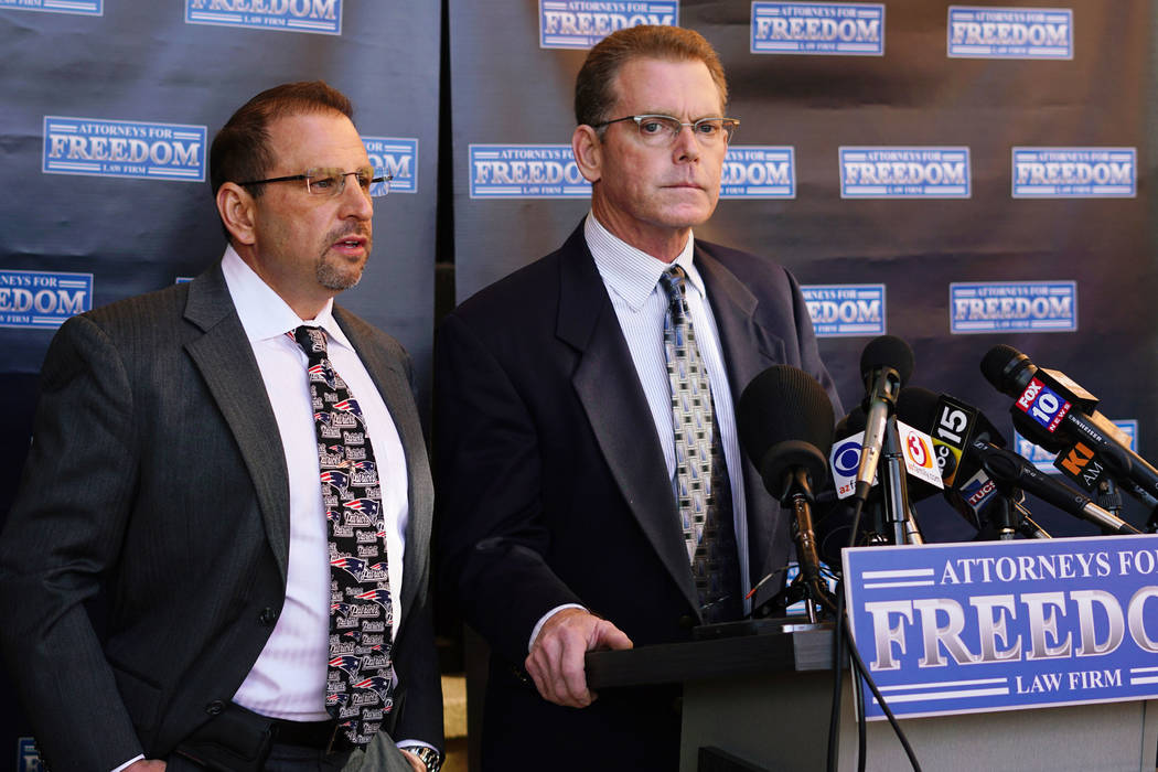 Douglas Haig, right, the man who was identified this week as a "person of interest" in the Las Vegas shooting investigation, speaks at a news conference with his attorney, Marc J. Victor, center,  ...