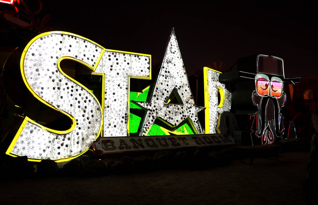 Signs are illuminated in "Brilliant!"Рan audiovisual immersion experience that uses technology advances to reanimate 40 monumental examples of the museum's iconic vintage s ...