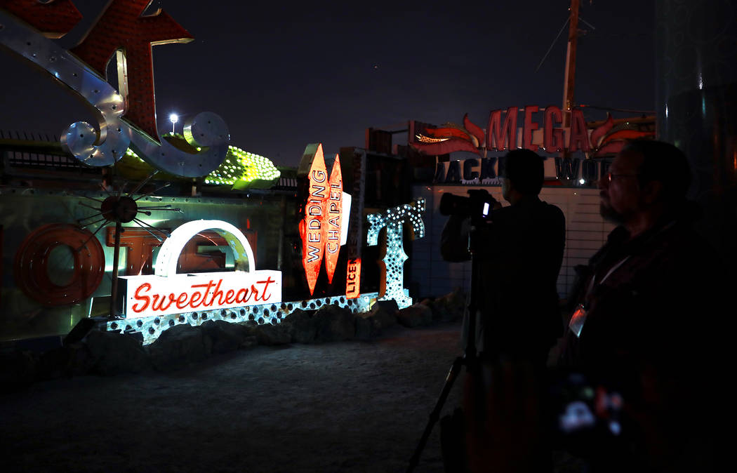 Signs are illuminated in "Brilliant!"Рan audiovisual immersion experience that uses technology advances to reanimate 40 monumental examples of the museum's iconic vintage s ...