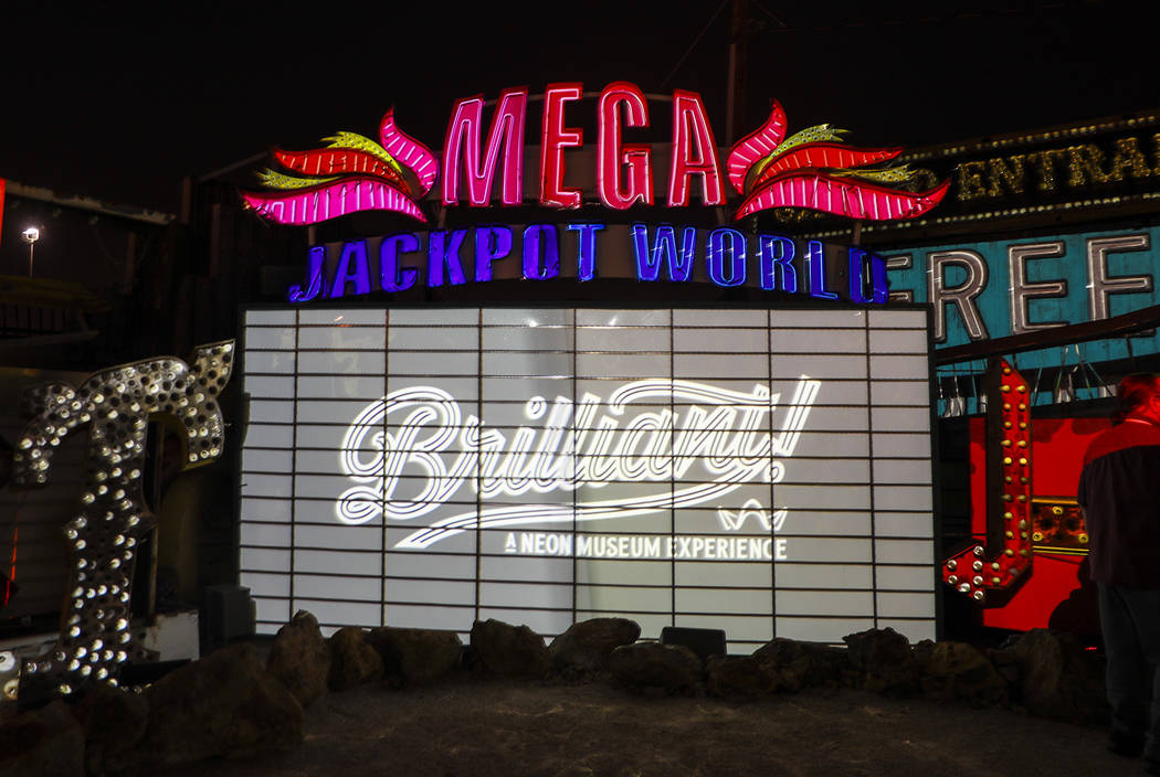 Signs are illuminated in "Brilliant!"Рan audiovisual immersion experience that uses technology advances to reanimate 40 monumental examples of the museum's iconic vintage s ...