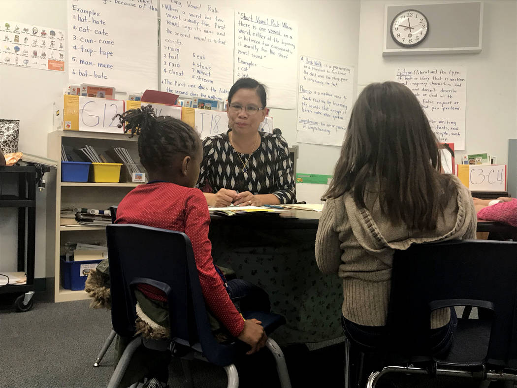 Violeta Brown, center, tutors students in the literacy lab at Lynch Elementary in Las Vegas on Thursday, Feb. 1, 2018. Amelia Pak-Harvey Las Vegas Review-Journal.
