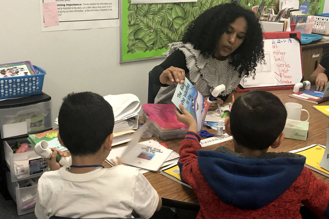Lewam Mekonnen, center, teaches students in a literacy lab at Lynch Elementary in Las Vegas on Thursday, Feb. 2018.  Amelia Pak-Harvey Las Vegas Review-Journal.
