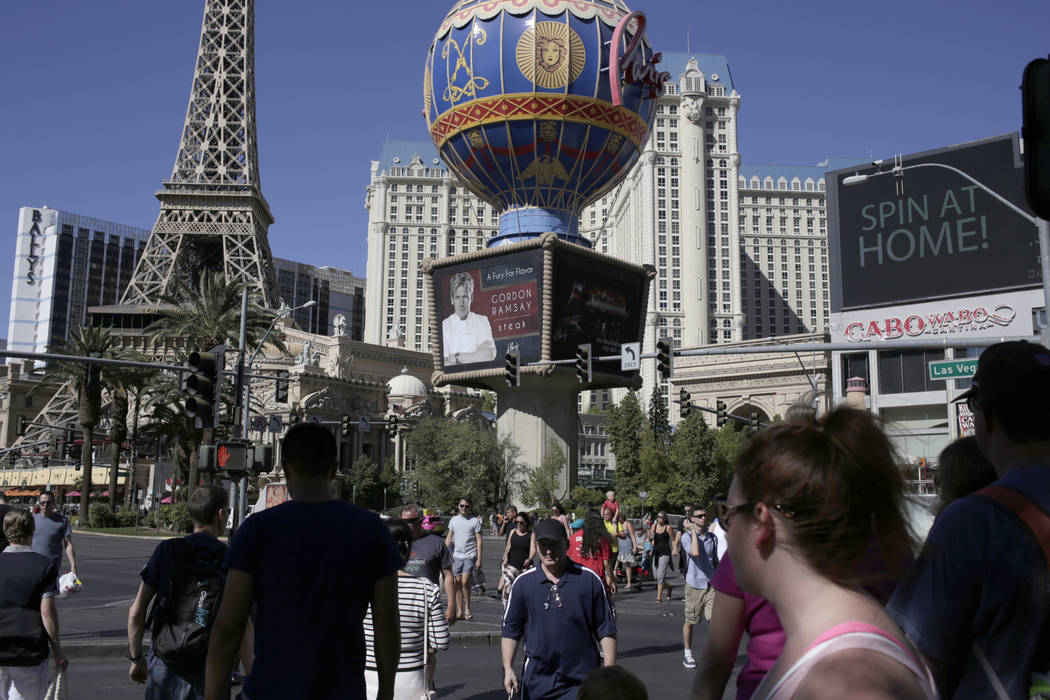 Tourists walk along the Las Vegas Strip in this file photo. (Gabriella Angotti-Jones/Las Vegas Review-Journal) @gabriellaangojo