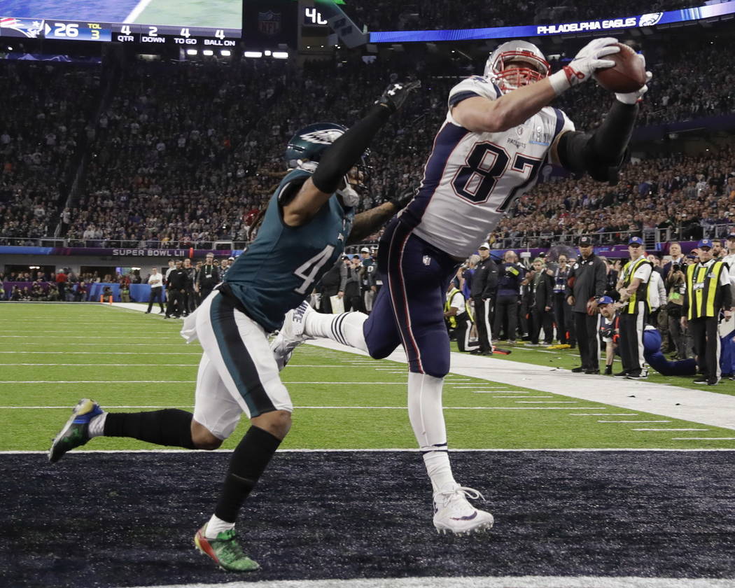 New England Patriots' Rob Gronkowski (87) makes a touchdown reception against Philadelphia Eagles cornerback Ronald Darby (41), during the second half of the NFL Super Bowl 52 football game, Sunda ...