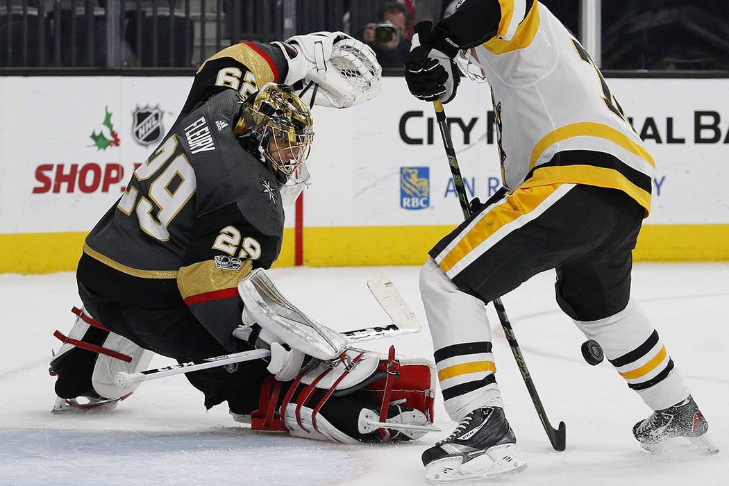 Vegas Golden Knights goalie Marc-Andre Fleury blocks a shot by Pittsburgh Penguins right wing Patric Hornqvist during the second period of an NHL hockey game Thursday, Dec. 14, 2017, in Las Vegas. ...