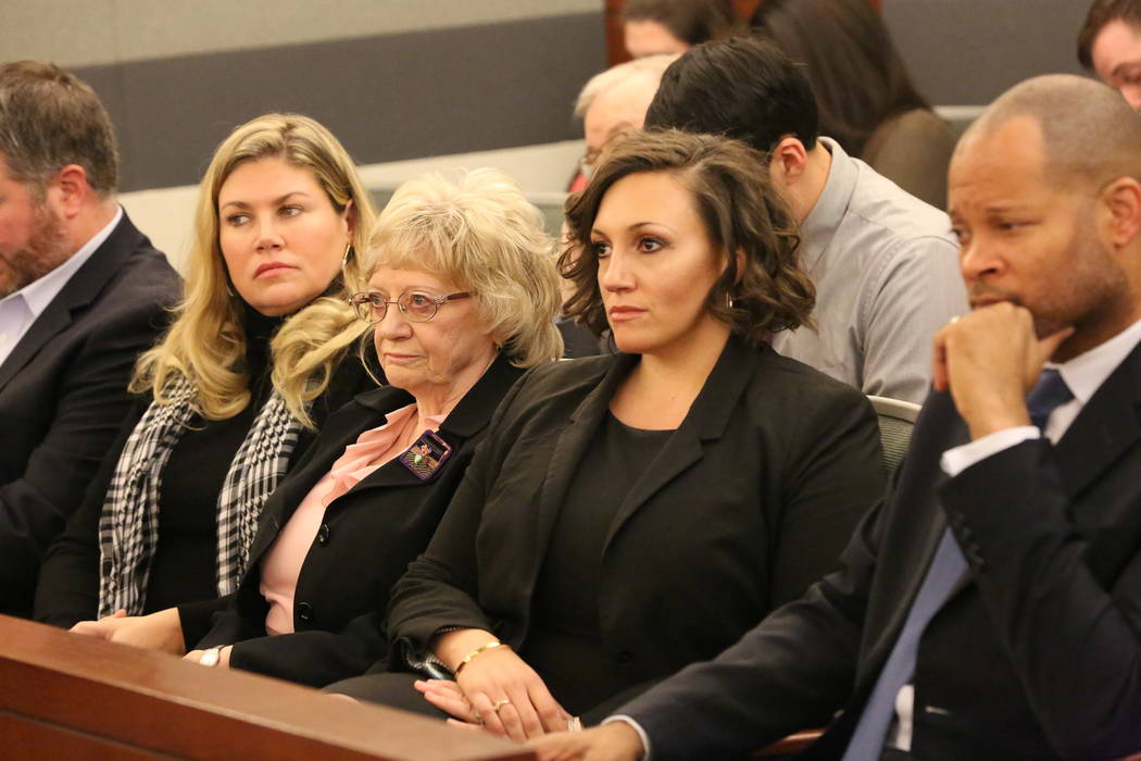 Recall opponents Joyce Woodhouse, center, and Nicole Cannizzaro, right, listen as attorney Marc Elias argues whether it is constitutional to allow people to have their names removed from a recall  ...