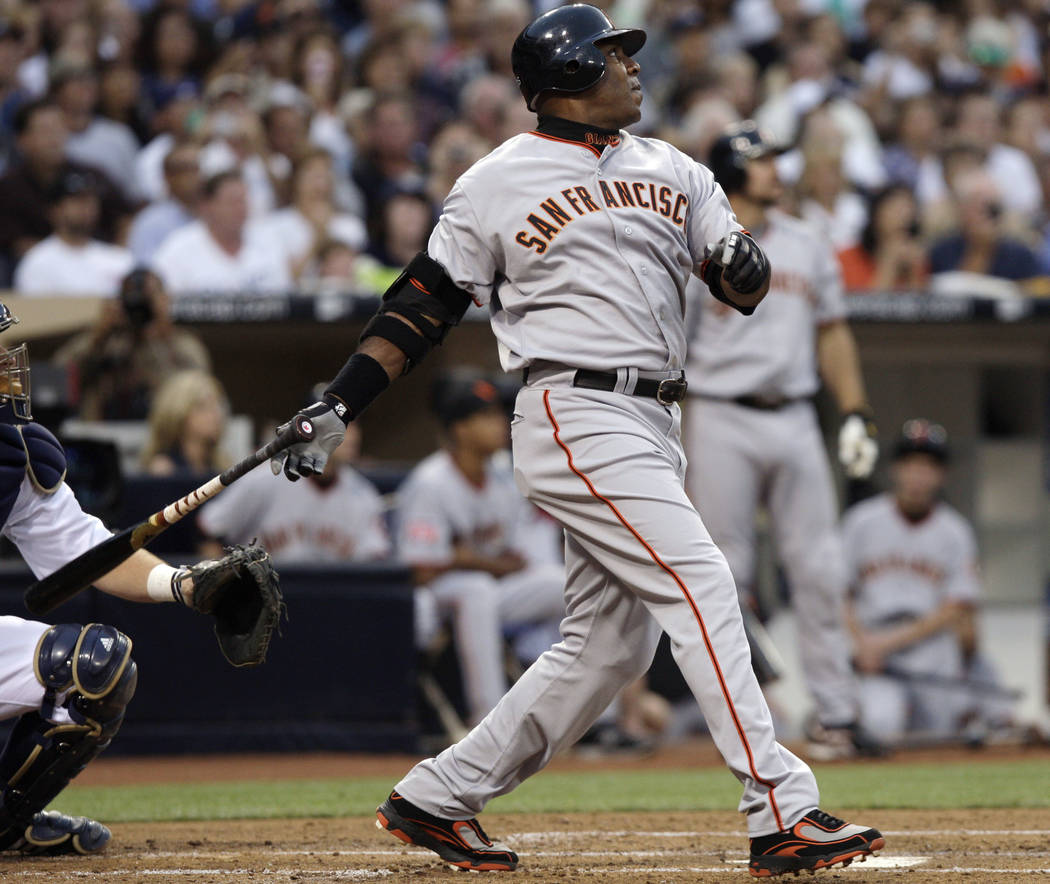 In this Aug. 4, 2007, file photo, San Francisco Giants' Barry Bonds watches  a home run, the 755th of his career, during the second inning of the team's  baseball game against the