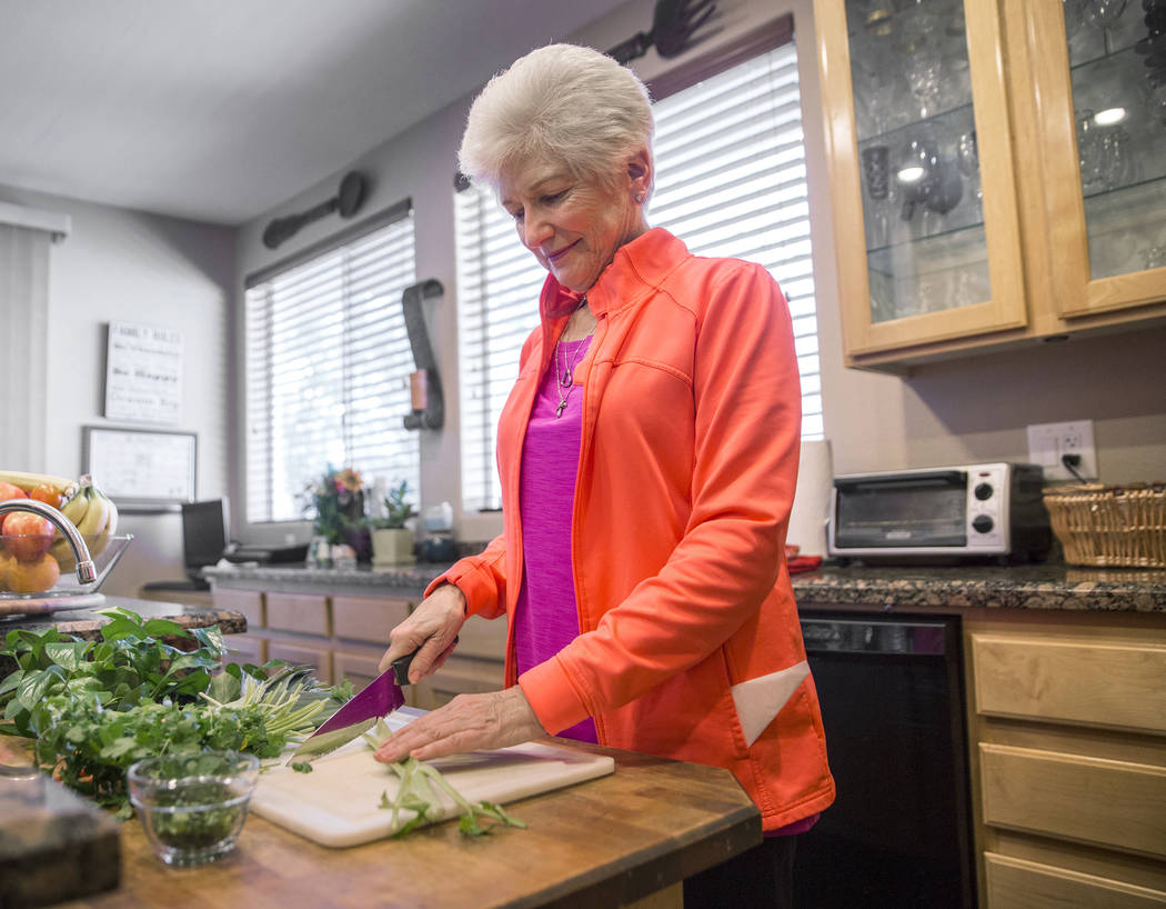 Writer/advocate Nancy Nelson, 74, cuts fresh vegetables for chicken soup on Monday, February 5, 2018, at Nelson's home, in Las Vegas. Nelson was diagnosed with early onset Alzheimerճ disease ...
