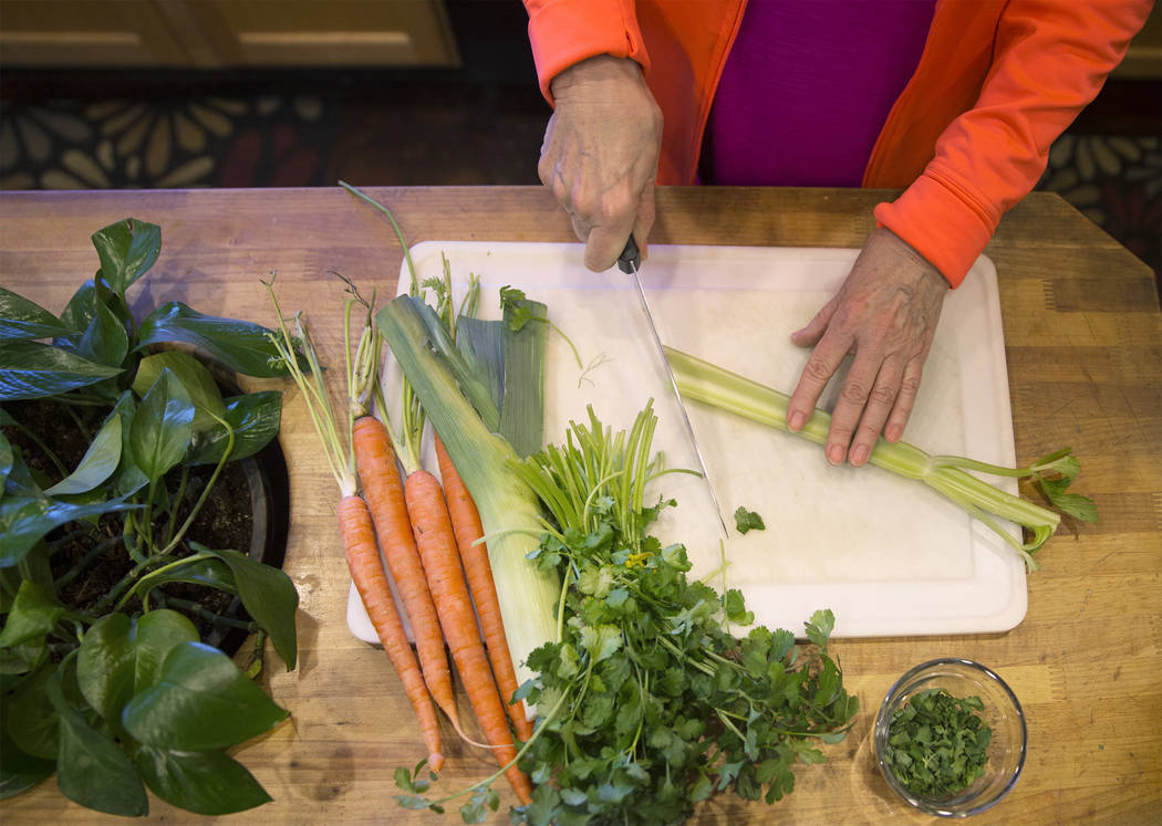 Writer/advocate Nancy Nelson, 74, cuts fresh vegetables for chicken soup on Monday, February 5, 2018, at Nelson's home, in Las Vegas. Nelson was diagnosed with early onset Alzheimerճ disease ...