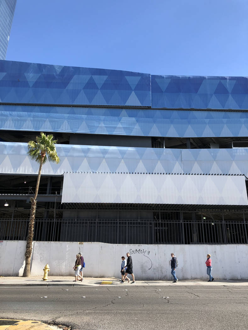 People walk past the unfinished former Fontainebleau on the Strip Monday, Feb. 12, 2018. The project, mothballed since the recession, is now called The Drew Las Vegas and scheduled to open in late ...