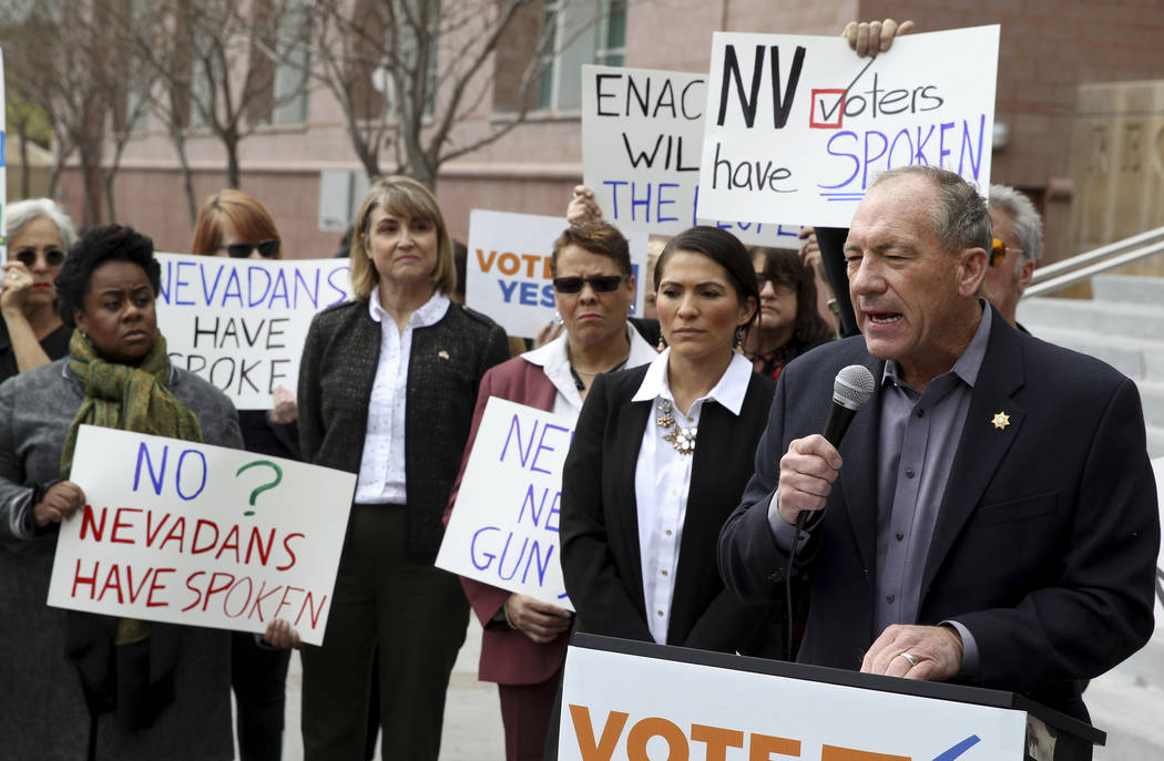 Former Clark County Sheriff Bill Young speaks with supporters of Question 1 outside the Regional Justice Center in Las Vegas on Friday, Feb. 23, 2018. (K.M. Cannon/Las Vegas Review-Journal via AP)