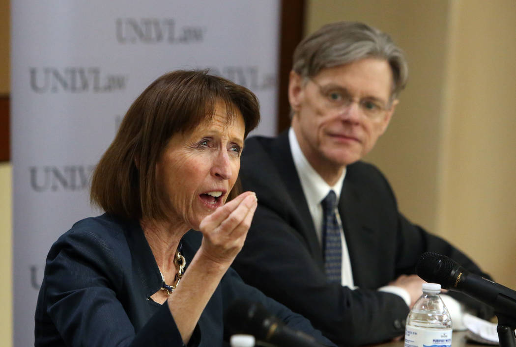Dr. Leslie C. Griffin, left, professor of Law at the University of Nevada, speaks as Stephen Bates, an associate professor in the Hank Greenspun School of Journalism and Media Studies at the Unive ...