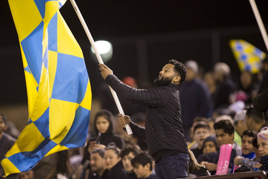 A fan waves a flag during the exhibition match between the Las Vegas Lights FC and Montreal Impact at Cashman Field in Las Vegas, Saturday, Feb. 10, 2018. Erik Verduzco Las Vegas Review-Journal @E ...