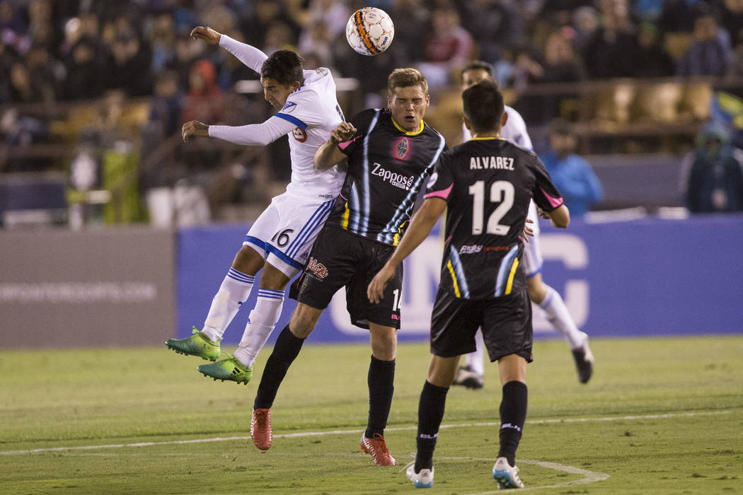 Montreal Impact’s Jeisson Vargas (16) and Las Vegas Lights FC Marcelo Alex Mendoza (14) fight for the ball during the exhibition match at Cashman Field in Las Vegas, Saturday, Feb. 10, 2018 ...