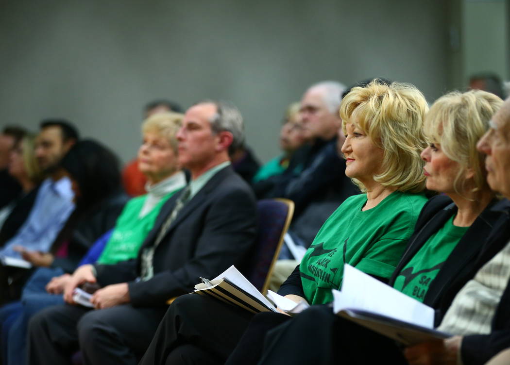 Denell Hahn, center right, a resident of the Black Mountain Golf and Country Club area, listens during a Henderson City Council meeting on Tuesday, Feb. 20, 2018. The course went into bankruptcy l ...