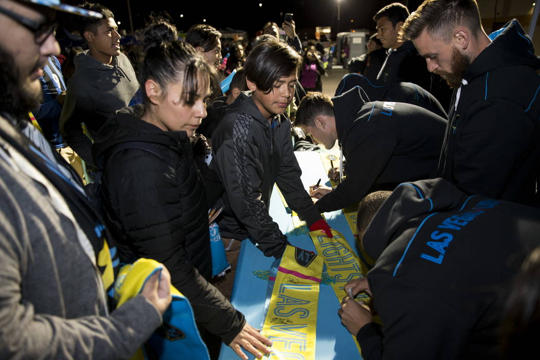 Las Vegas Lights FC players sign autographs before their soccer game against D.C. United at Cashman Field in Las Vegas, Saturday, Feb. 24, 2018. Erik Verduzco Las Vegas Review-Journal @Erik_Verduzco