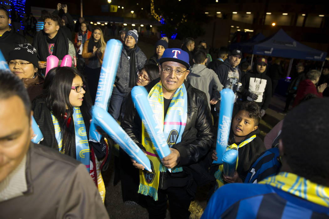 Gerardo Tercero, center, of Las Vegas, with his children Perla, 10, left, and Leonardo, outside of Cashman Field before the exhibition soccer game between Las Vegas Lights FC and D.C. United in La ...