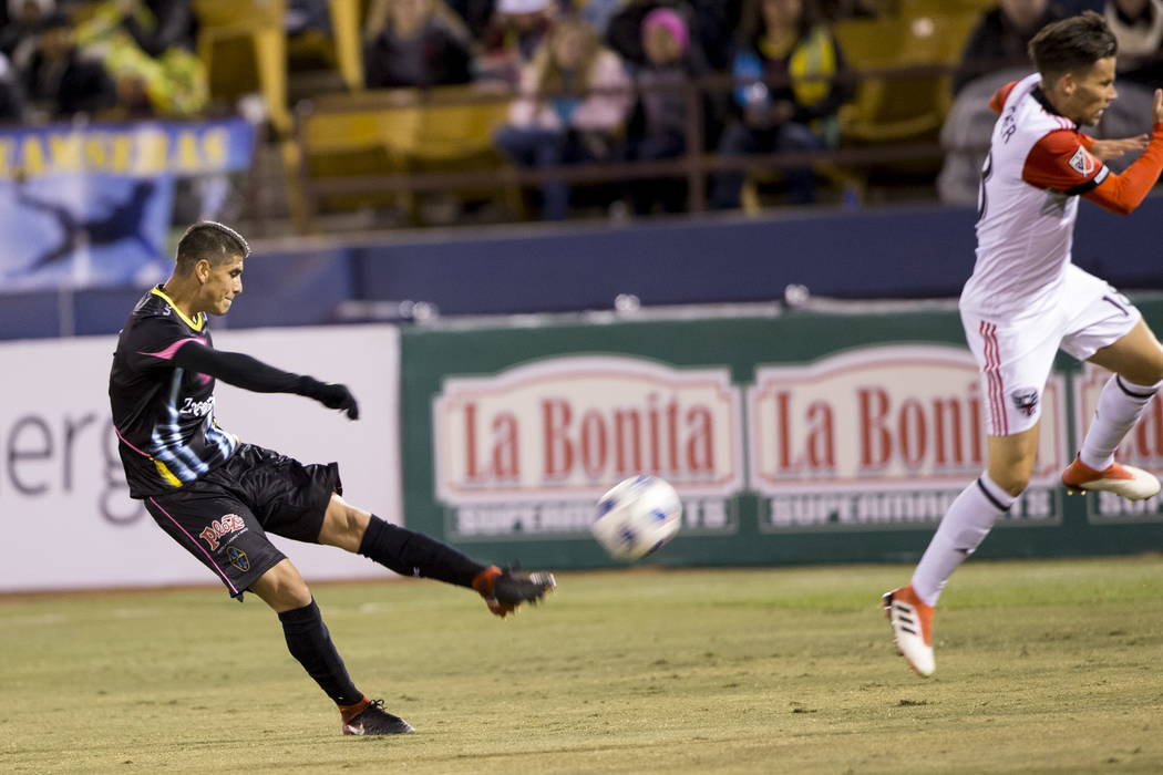 Las Vegas Lights FC’s Christian Torres (3) takes a shot against D.C. United during the first half of the exhibition soccer game at Cashman Field in Las Vegas, Saturday, Feb. 24, 2018. Erik  ...