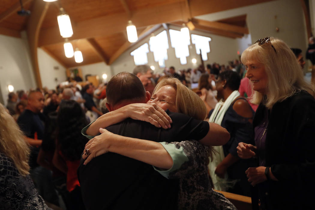 Congregation members embrace during a service at the First United Methodist Church of Coral Springs in Coral Springs, Fla., Sunday, Feb. 18, 2018. The service was dedicated to the victims of the W ...