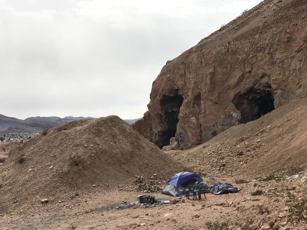 A squatter's tent sits near the opening of an abandoned gypsum mine near Fort Apache and Warm Springs roads on Wednesday, Feb. 21, 2018. (Henry Brean/Las Vegas Review-Journal)