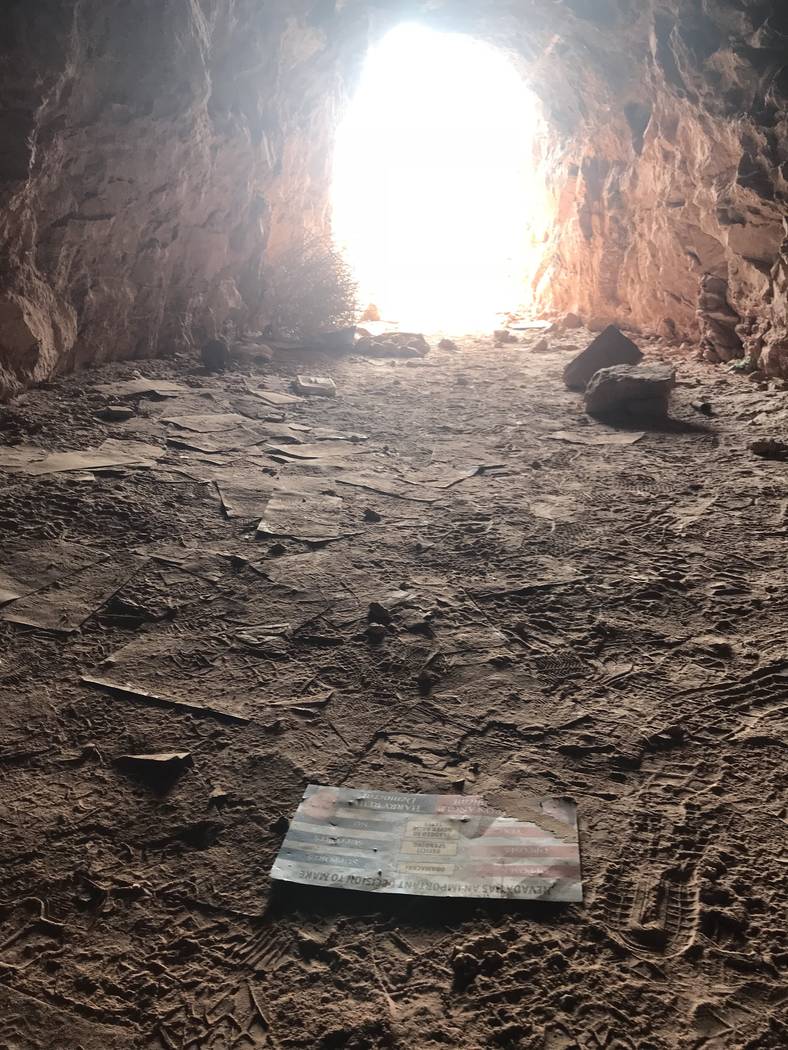 Campaign mailers from a 2010 senate race litter the floor of an abandoned mine shaft near Fort Apache and Warm Springs roads on Wednesday, Feb. 21, 2018. (Henry Brean/Las Vegas Review-Journal)