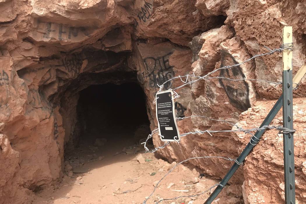 Someone has rolled back the barbed wire fence that once blocked the entrance to this abandoned mine shaft near Fort Apache and Warm Springs roads on Wednesday, Feb. 21, 2018. Henry Brean ...