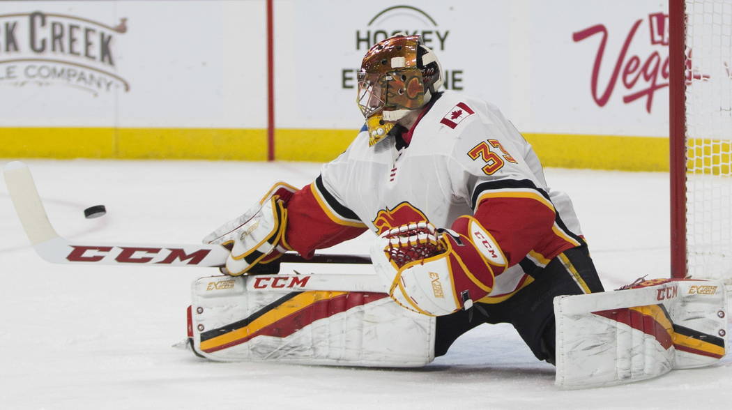 Calgary Flames goaltender David Rittich (33) defends a shot against Vegas Golden Knights during the first period of an NHL game at T-Mobile Arena in Las Vegas, Wednesday, Feb. 21, 2018. Erik Verd ...