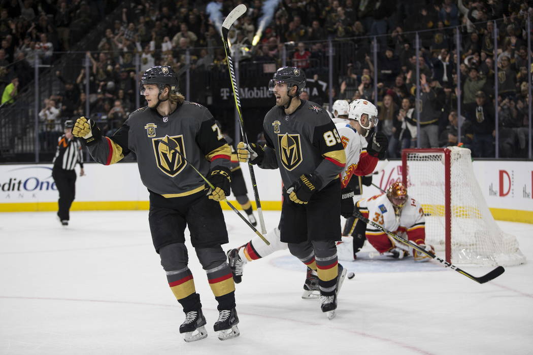 Vegas Golden Knights center William Karlsson (71) celebrates his score with right wing Alex Tuch (89) during the first period of an NHL game  at T-Mobile Arena in Las Vegas, Wednesday, Feb. 21, 20 ...