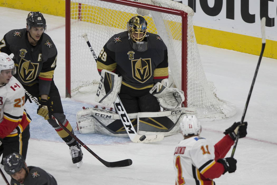 Vegas Golden Knights goaltender Marc-Andre Fleury (29) defends a shot by Calgary Flames center Mikael Backlund (11) during the second period of an NHL hockey game at T-Mobile Arena in Las Vegas, W ...