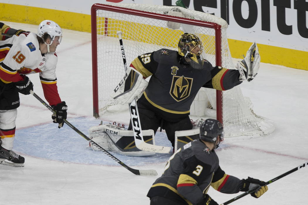 Vegas Golden Knights goaltender Marc-Andre Fleury (29) makes a stop against Calgary Flames during the second period of an NHL hockey game at T-Mobile Arena in Las Vegas, Wednesday, Feb. 21, 2018. ...