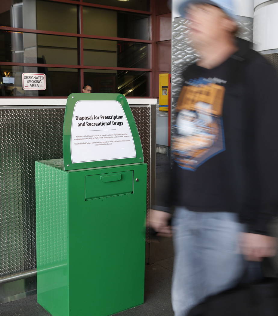 A passenger walks past a recently installed marijuana amnesty drop box at McCarran International Airport on Thursday, Feb.  22, 2018, in Las Vegas. Bizuayehu Tesfaye/Las Vegas Review-Journal @bizu ...