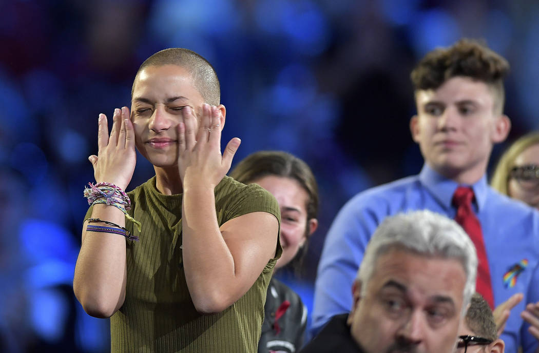 Marjory Stoneman Douglas High School student Emma Gonzalez wipes away tears during a CNN town hall meeting, Wednesday, Feb. 21, 2018, at the BB&T Center, in Sunrise, Fla. (Michael Laughlin/Sou ...