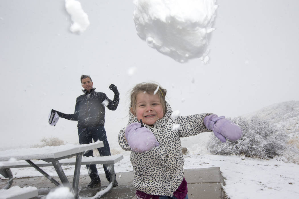 Danny Vasquez of Las Vegas and his daughter Nika, 4, throw snowballs at Red Rock Canyon Overlook, Friday, Feb. 23, 2018 near Las Vegas. Richard Brian Las Vegas Review-Journal @vegasphotograph