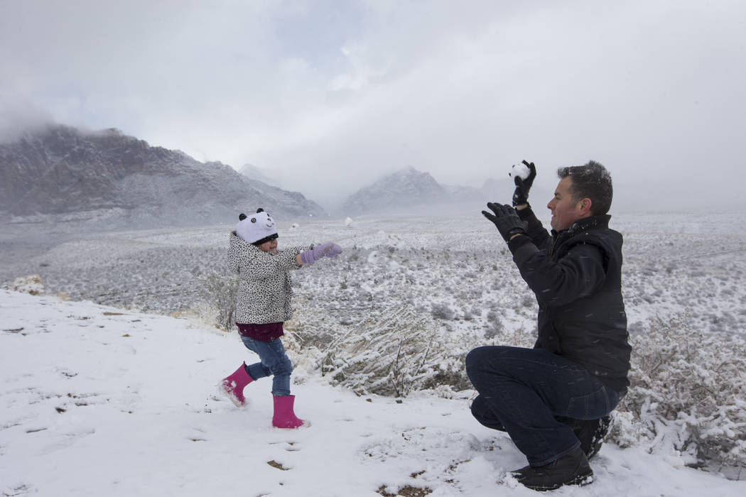 Danny Vasquez of Las Vegas and his daughter Nika, 4, play in the snow at Red Rock Canyon Overlook, Friday, Feb. 23, 2018 near Las Vegas. Richard Brian Las Vegas Review-Journal @vegasphotograph