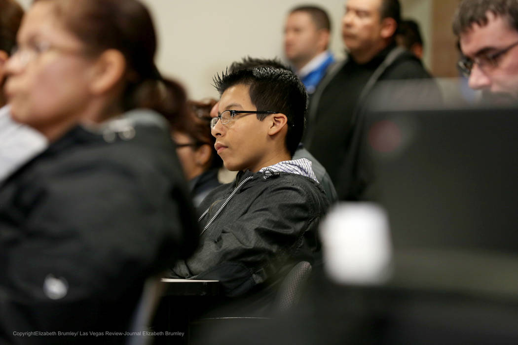 Erick Ruiz, a ninth grade student at Odyssey Charter High School, sits after sharing his opinion against transgender policies for the Clark County School District at  Nevada Department of Educatio ...