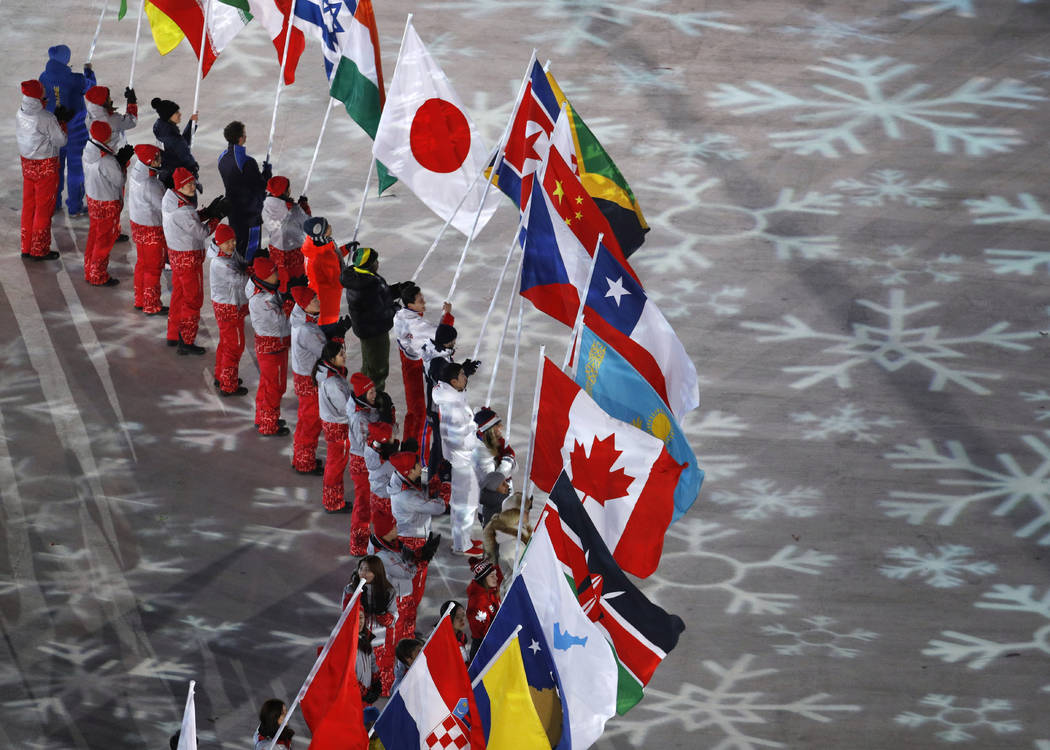 Flag bearers from various nations attend the closing ceremony of the 2018 Winter Olympics in Pyeongchang, South Korea, Sunday, Feb. 25, 2018. (AP Photo/Charlie Riedel)