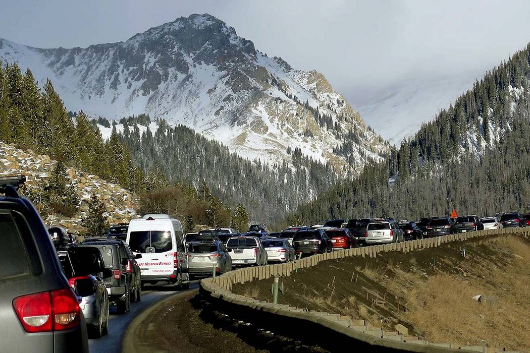 In this Jan. 7, 2018, photo, traffic backs up on Interstate 70 in Colorado, a familiar scene on the main highway connecting Denver to the mountains The chairman of a committee exploring whether De ...