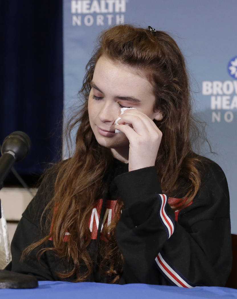 Marjory Stoneman Douglas High School shooting survivor Maddy Wilford wipes a tear from her eye during a press conference at Broward Health North in Deerfield Beach, Fla., Monday, Feb. 26, 2018. (A ...