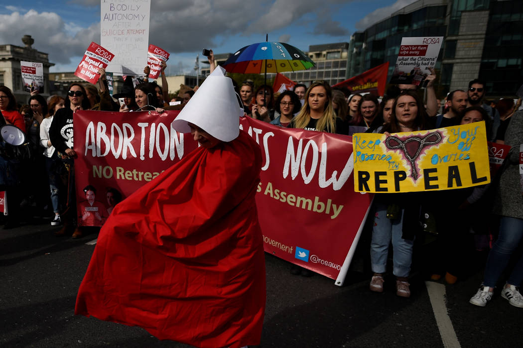 Demonstrators hold posters as they march for more liberal Irish abortion laws, in Dublin, Ireland September 30, 2017. REUTERS/Clodagh Kilcoyne