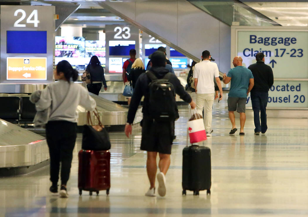 Passengers arrive at Terminal-3 baggage claim area at McCarran International Airport on Wednesday, Feb. 28, 2018, in Las Vegas. (Bizuayehu Tesfaye/Las Vegas Review-Journal) @bizutesfaye