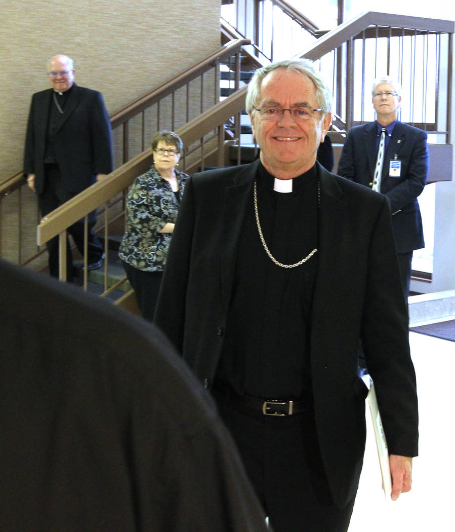 Bishop George Leo Thomas of the Diocese of Helena walks to a news conference at the Diocese of Las Vegas Wednesday, Feb. 28, 2018, where he was introduced as the new bishop of the Roman Catholic D ...