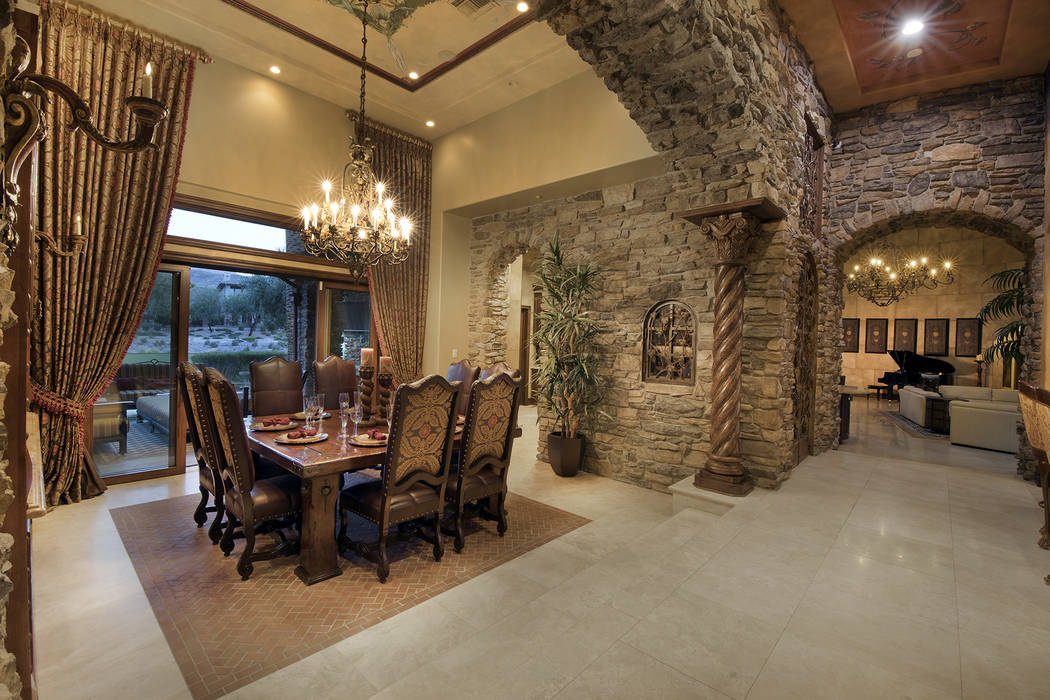 The dining room has golf course views. (Synergy/Sotheby’s International Realty)