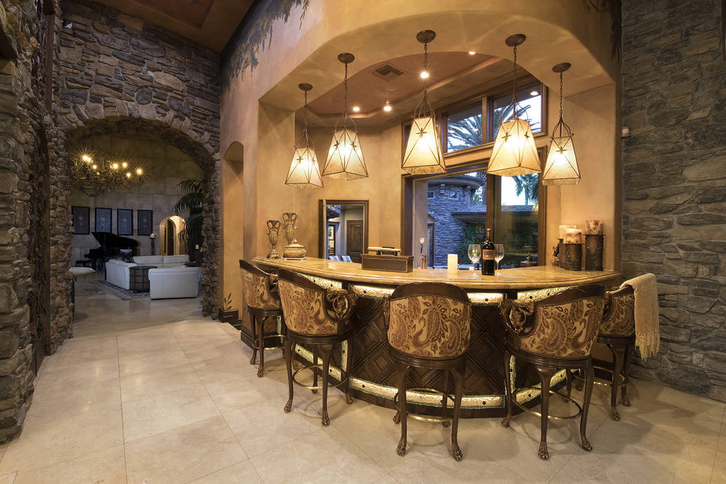 Built for entertainment the home has several bar areas. (Synergy/Sotheby’s International Realty)