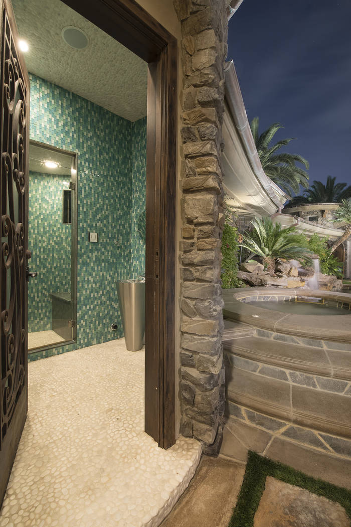 There is a bathroom at the pool. (Synergy/Sotheby’s International Realty)
