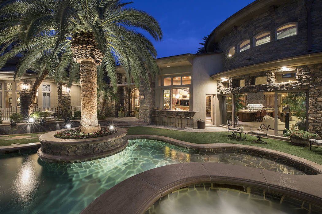 Dragon Rock at MacDonald Highlands features a front courtyard and pool. (Synergy/Sotheby’s International Realty)