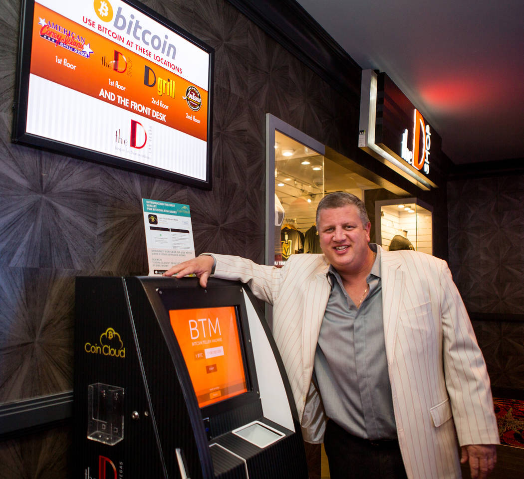 Derek Stevens, CEO and owner of the D Las Vegas, in front of a Bitcoin ATM in the D Las Vegas on Thursday, Feb. 15, 2018. The hotel-casino is now accepting Bitcoin at some of its restaurants, gift ...