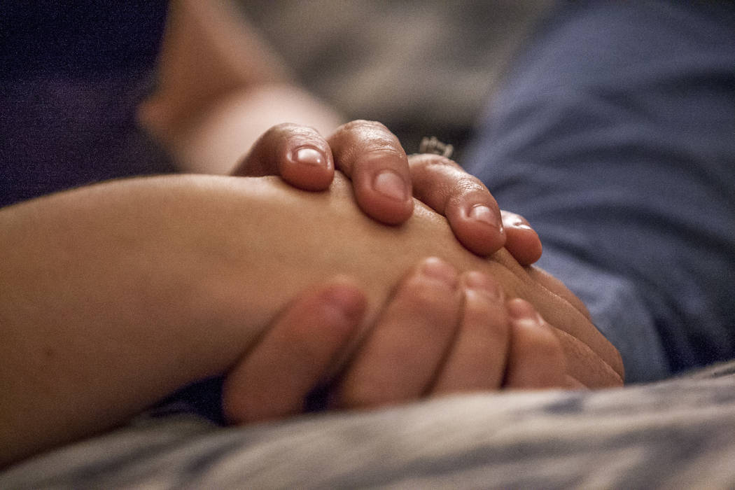 William King, a Route 91 Harvest festival shooting survivor, holds hands with his fiancée Kimberly King at their Summerlin home on Wednesday, Jan. 31, 2018. Patrick Connol ...