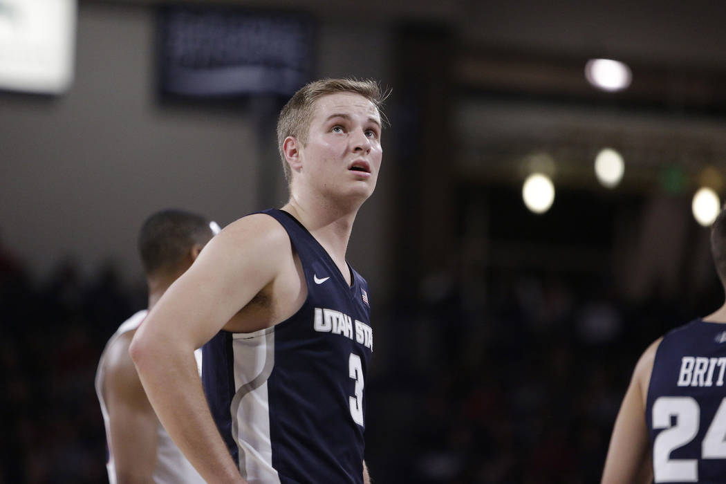 Utah State guard Sam Merrill (3) stands on the court during the first half of an NCAA college basketball game against Gonzaga in Spokane, Wash., Saturday, Nov. 18, 2017. (AP Photo/Young Kwak)