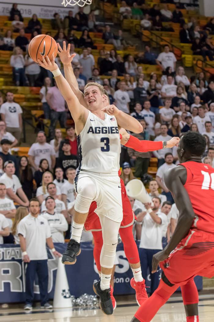 Utah State's Sam Merrill drives to the basket against New Mexico on Jan. 31. Photo courtesy of Rick Parker, Utah State athletics.